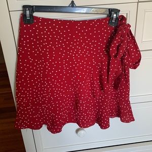 Red and White polka dot, crossover, mini skirt. Womens size small.